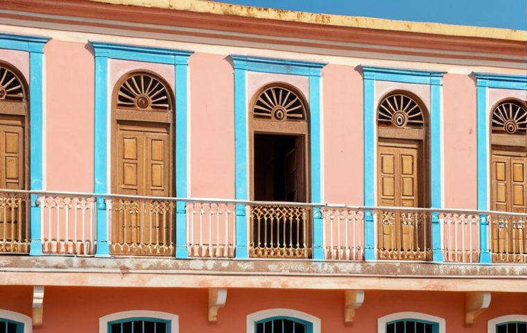 A pastel-colored colonial building in the old city of Bissau, Guinea-Bissau, showcasing Portuguese architectural influence with delicate decorations and sunlit facade.